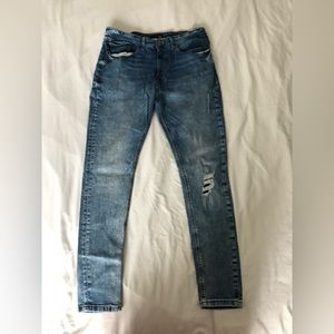 Skinny blue denim jeans. Size: says 42 but fits 34. Brand: Urban clothing.